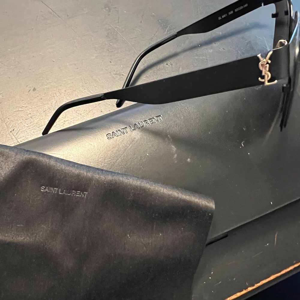 Black Metal YSL with gold accent glasses. No scratches